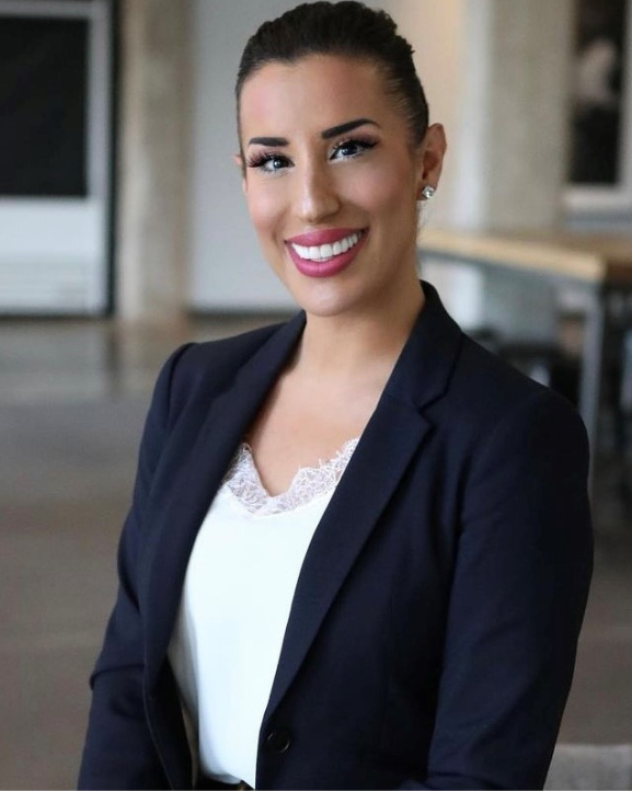 Amanda Hamilton smiles in an office